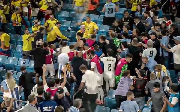 Tuyển thủ Uruguay lao lên khán đài đánh cổ động viên Colombia